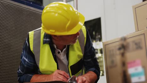 engineer writing on clipboard