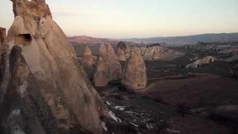 Advancing-Aerial-Drone-Footage-Flying-Low-Between-Fairy-Chimneys-Revealing-Landscape