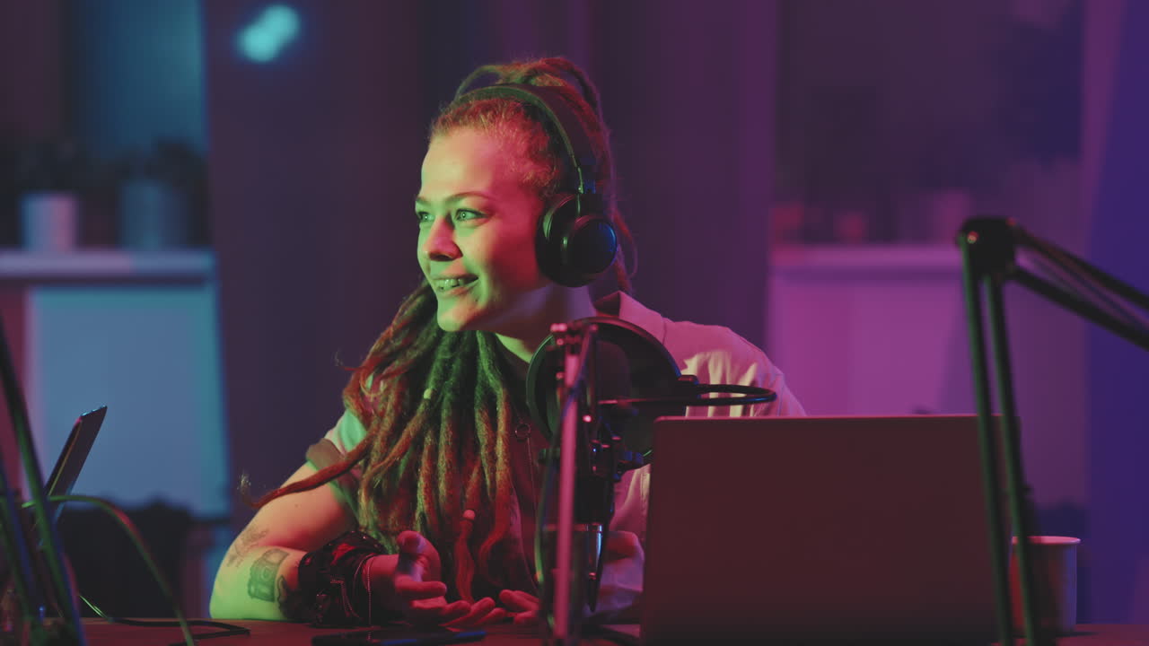 Woman with Dreadlocks on Podcast