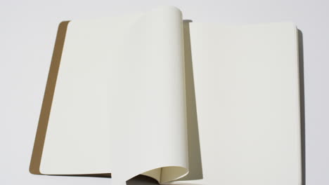 Video-of-book-with-white-blank-pages-and-copy-space-on-white-background