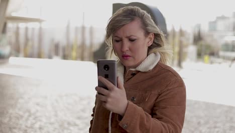 upset middle aged woman having video call through smartphone