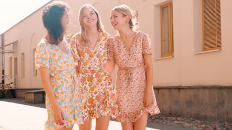 three women in floral dresses