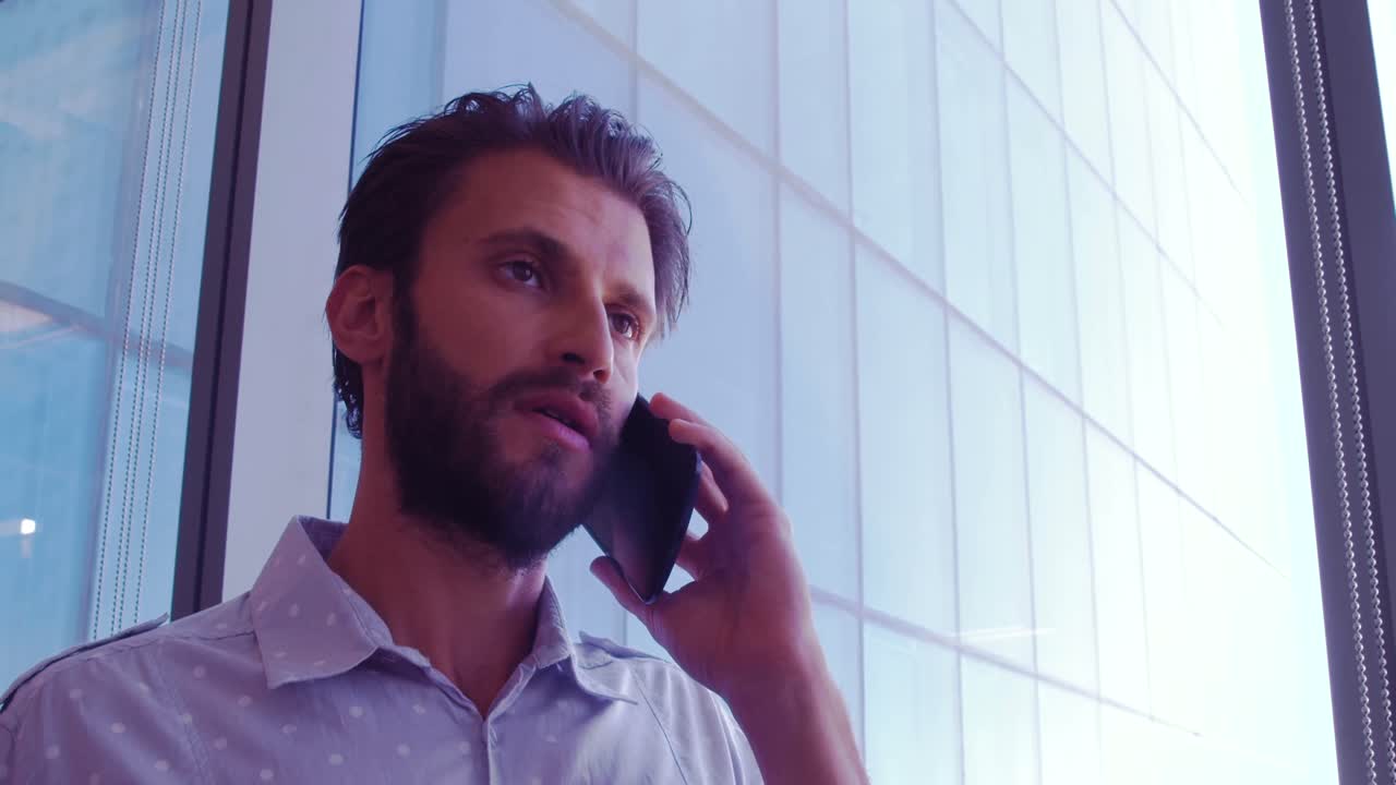 Executive talking on mobile phone