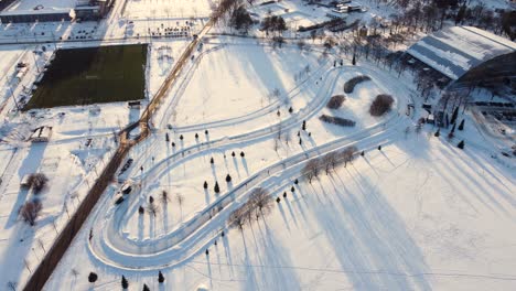 ice skating track in a large park on a sunny winter afternoon