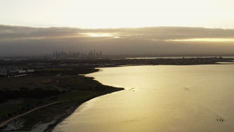 glorious city reflections on a calming melbourne morning aerial shot over the golden coastline