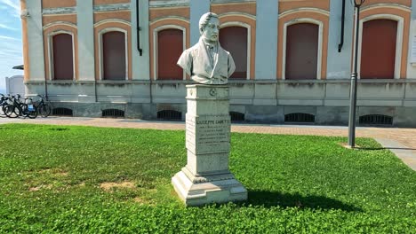 statue and building facade in cuneo, italy