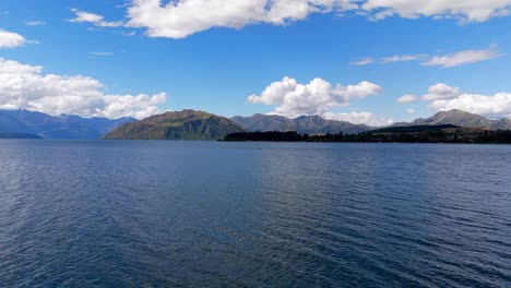 Moving-drone-shot-of-the-iconic-Lake-Wanaka-in-New-Zealand-during-the-month-of-December