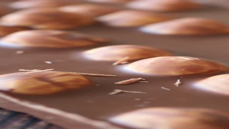 close up of a chocolate bar with hazelnuts