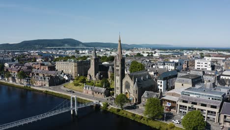 drone shot pulling away from the free church of scotland building in downtown inverness