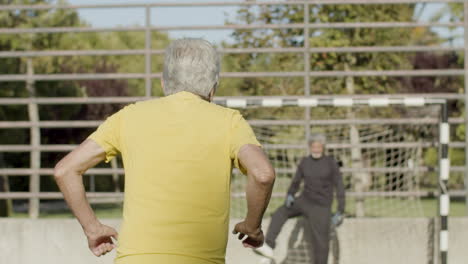 happy senior sportsman celebrating success after scoring goal