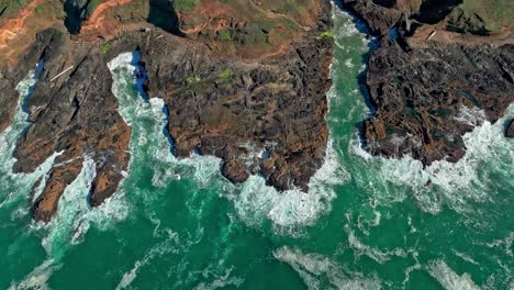 Located-in-the-Cape-Perpetua-Scenic-Area,-just-three-miles-south-of-Yachats-Oregon,-Thor's-Well-is-a-bowl-shaped-hole-carved-out-of-the-rough-basalt-shoreline