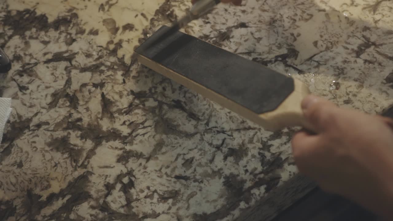 Close Up Of Knife Sharpening