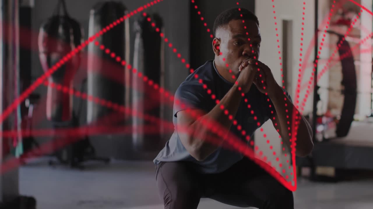 체육관에서 운동하는 아프리카계 미국인 남성 위의 dna  ⁇ 의 애니메이션