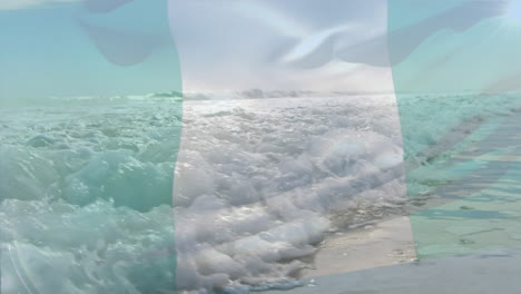 composición digital de ondear la bandera de nigeria contra las olas en el mar