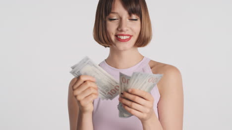 smiling wealthy girl counting banknotes