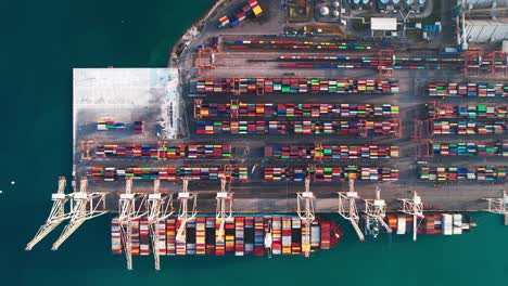 Aerial-View-Of-The-Shipping-Port-In-Koper-Capodistria-Slovenia-Loaded-With-Cranes-And-Colorful-Cargo-Containers