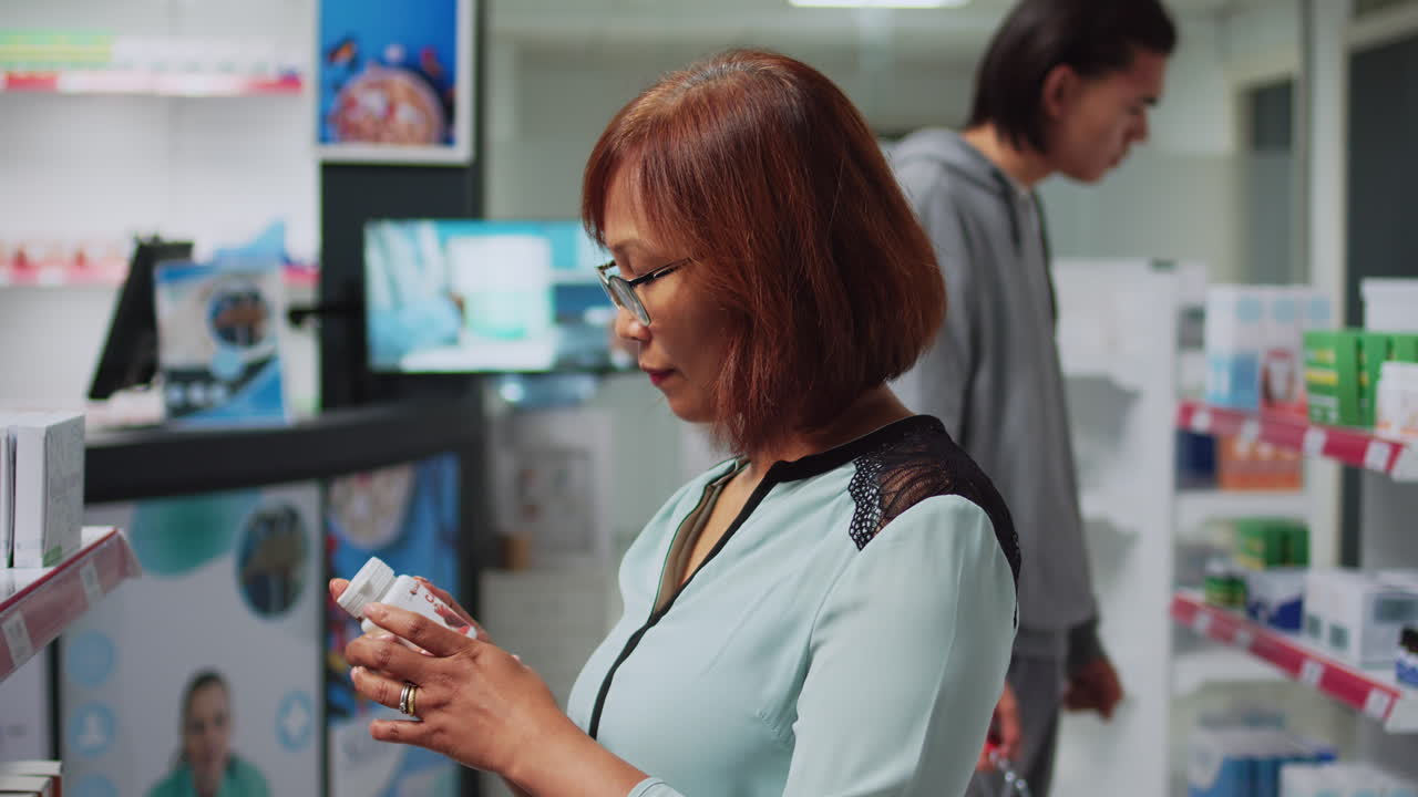 Customers browsing medication in a pharmacy