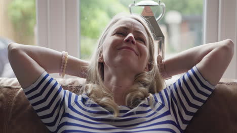 woman relaxing at home on couch