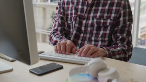 young man working in a creative office