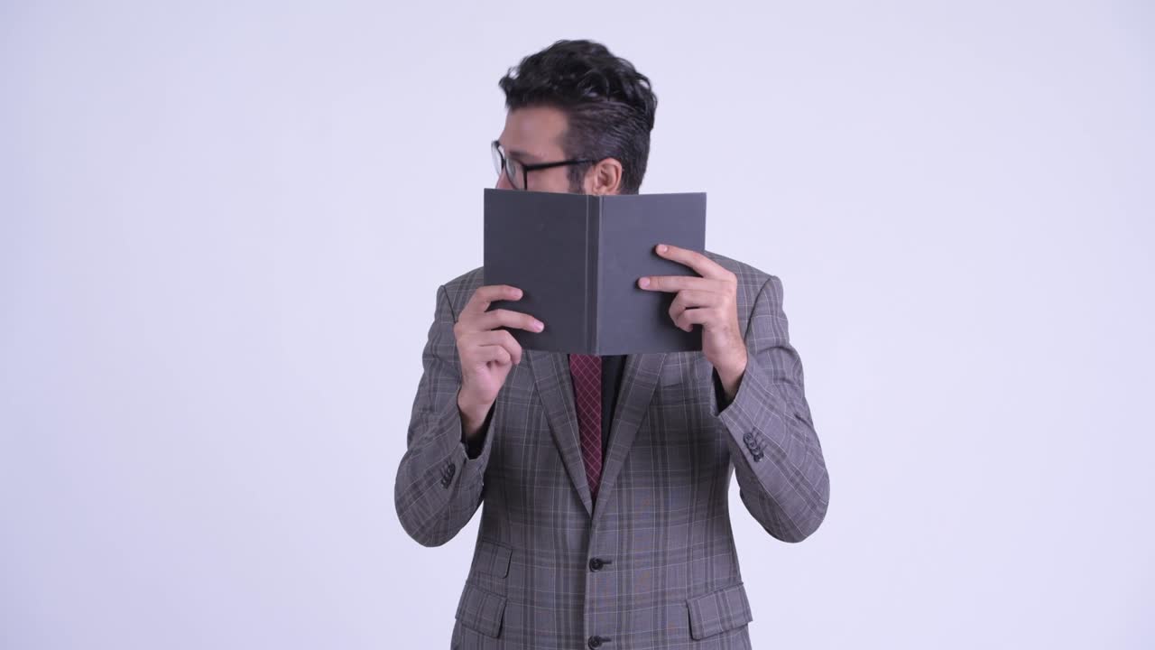 Handsome bearded Persian businessman in suit
