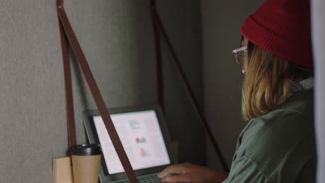 young caucasian woman student using digital laptop computer working brainstorming business ideas browsing online study in private office cubicle