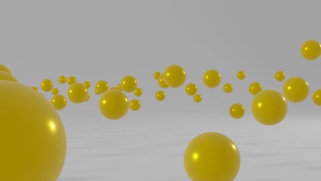 yellow balls floating on a white background. simple motion graphic seamless loop animation