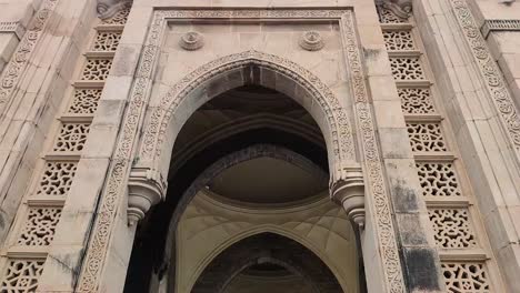 close up, tilt-up shot of the famous tourist destination, the gate way of india mumbai -