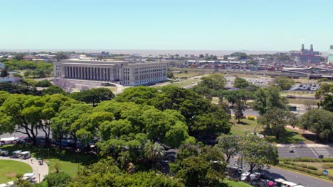 Dolly-in-aerial-view-of-the-Recoleta-neighborhood-on-a-spring-day-with-leafy-trees-and-the-UBA-law-school