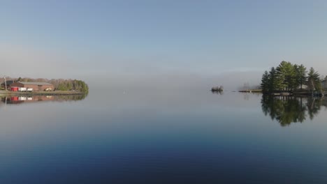 glassy water over greenville cove aerial tracking forward