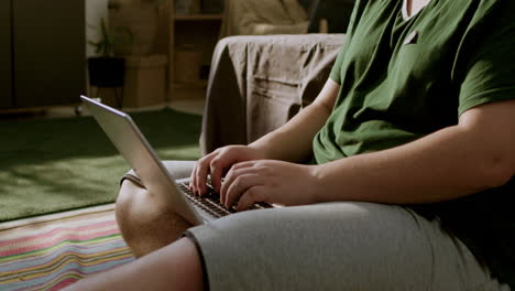 Young-man-sitting-on-the-floor