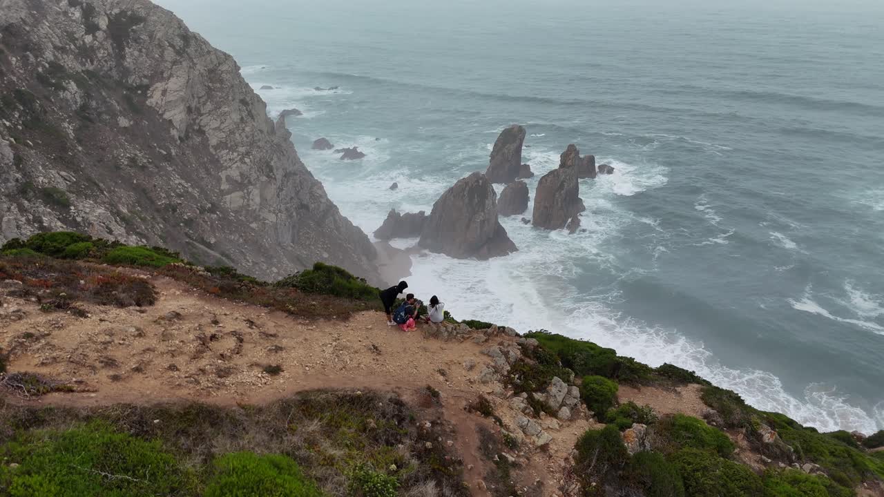 Coastal Cliffside View with People