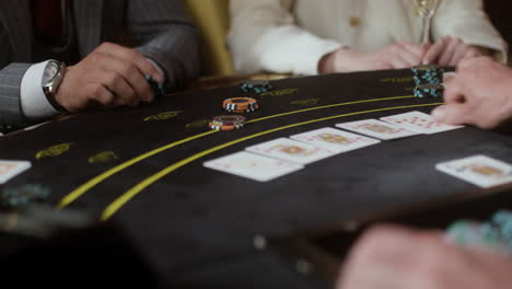 people playing poker at the casino.