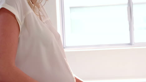 pregnant woman slicing vegetables