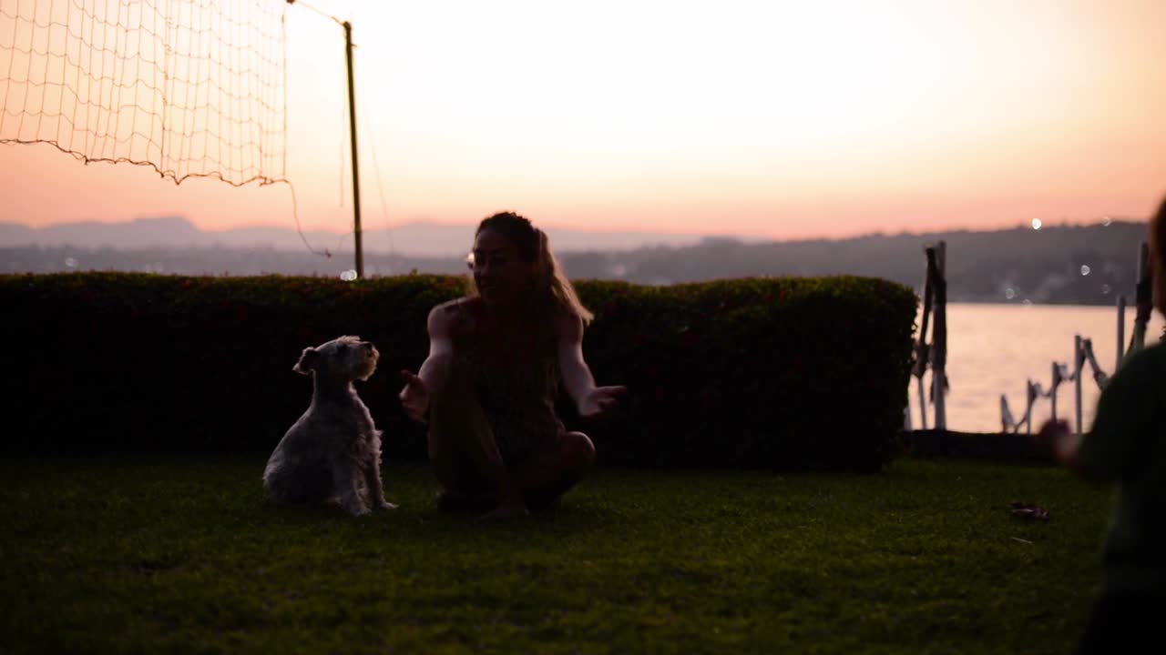 Happy cute Latin baby boy walking on the grass having fun at dusk