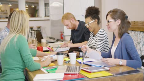 cheerful team working at table