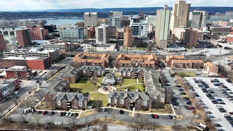 Aerial-tilt-up-reveal-of-Harrisburg-skyline-with-neighborhood