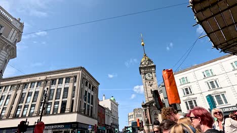 people walking near brighton's iconic clock tower