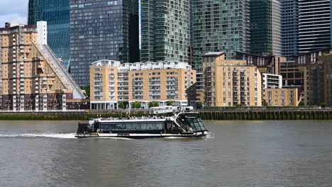 avalon waterways suite ship passing canary wharf, london, united kingdom