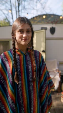 teenage girl in colorful poncho