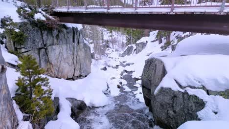 Aerial-flyunder-Eagle-Falls-Bridge,-Desolation-Wilderness,-Lake-Tahoe,-California