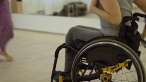 male choreographer dancing with paraplegic woman