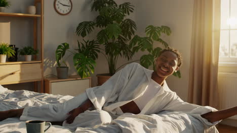 joyful woman in pajamas in bedroom