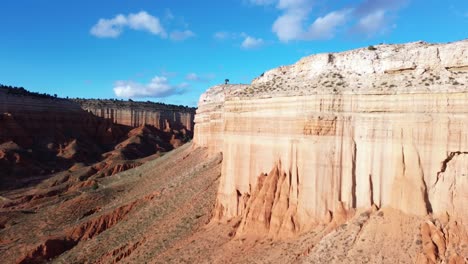 aerial flyover of the tall rock walls of the red canyon of teruel