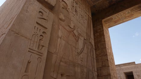 Stunning-hieroglyphs-carved-on-walls-at-Medinet-Habu,-Luxor,-Egypt