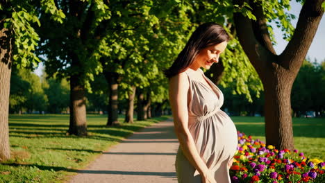 pregnant woman walking in a park