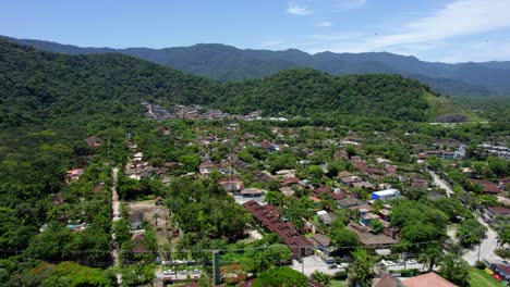 aerial view flying over the barra do sahy village, in sunny sao sebastiao, brazil