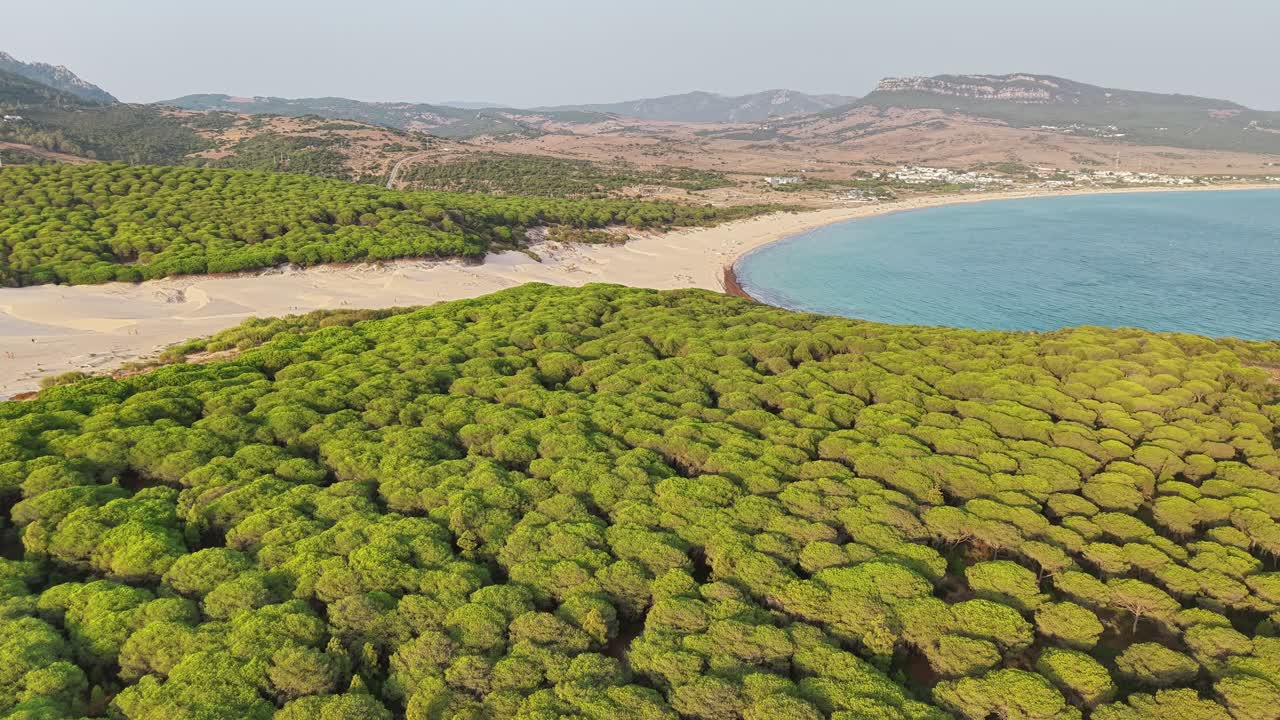 aerial view of Bolonia dunes meeting turquoise sea in Cadiz Spain