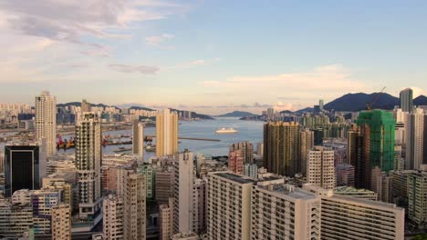 Hong-Kong-bay-and-skyline-with-skyscrapers,-high-altitude-wide-shot