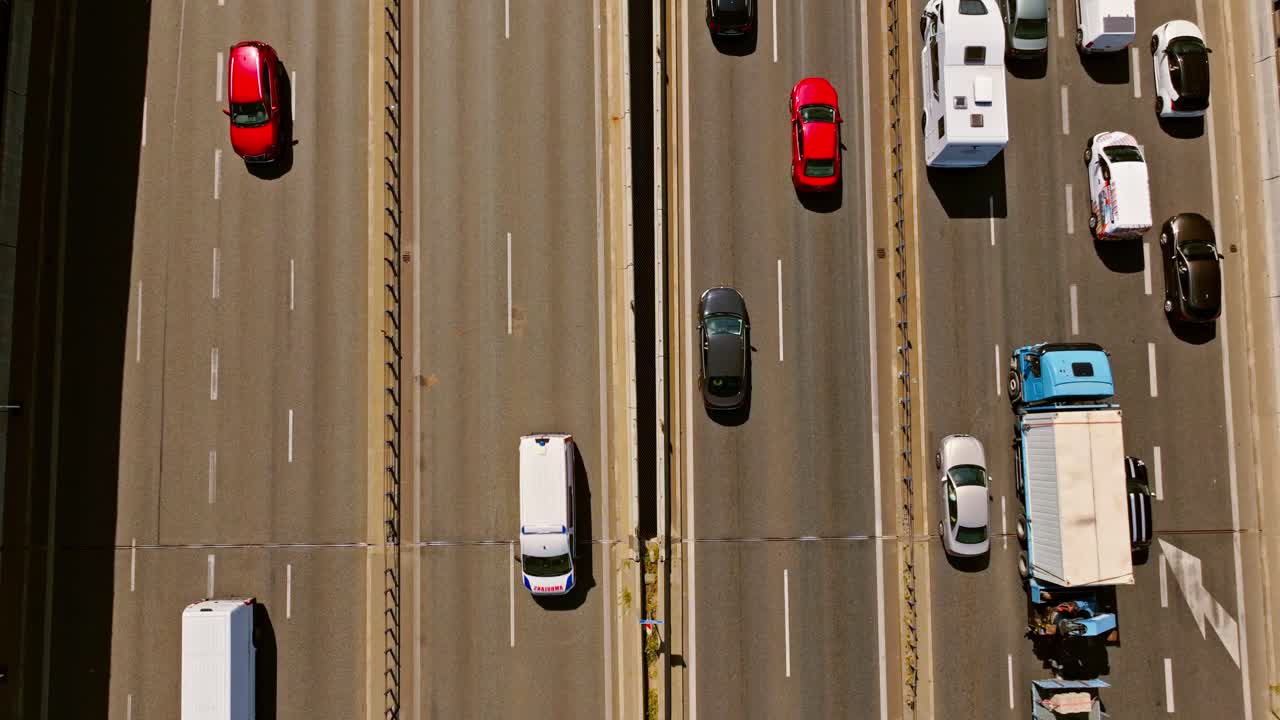 Top down static view of Warsaw highway with trucks and cars in traffic flow