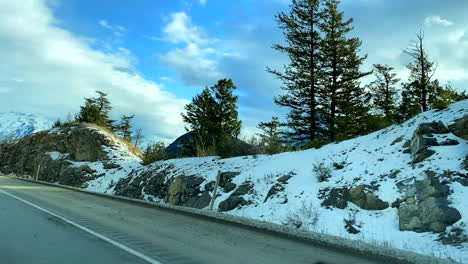 Winter road trip in Canada, seeing beautiful mountains.
